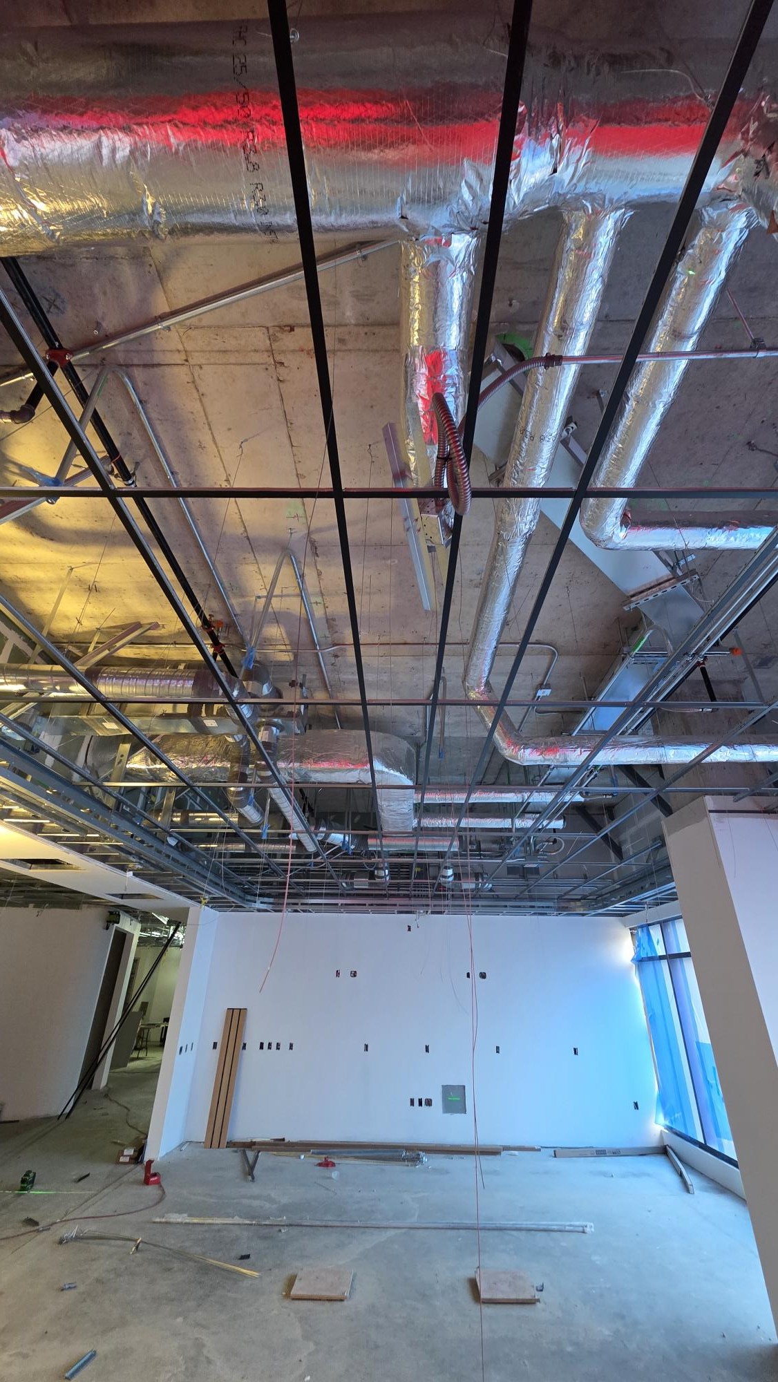 An upward view records the relationship between the grid and services above it.