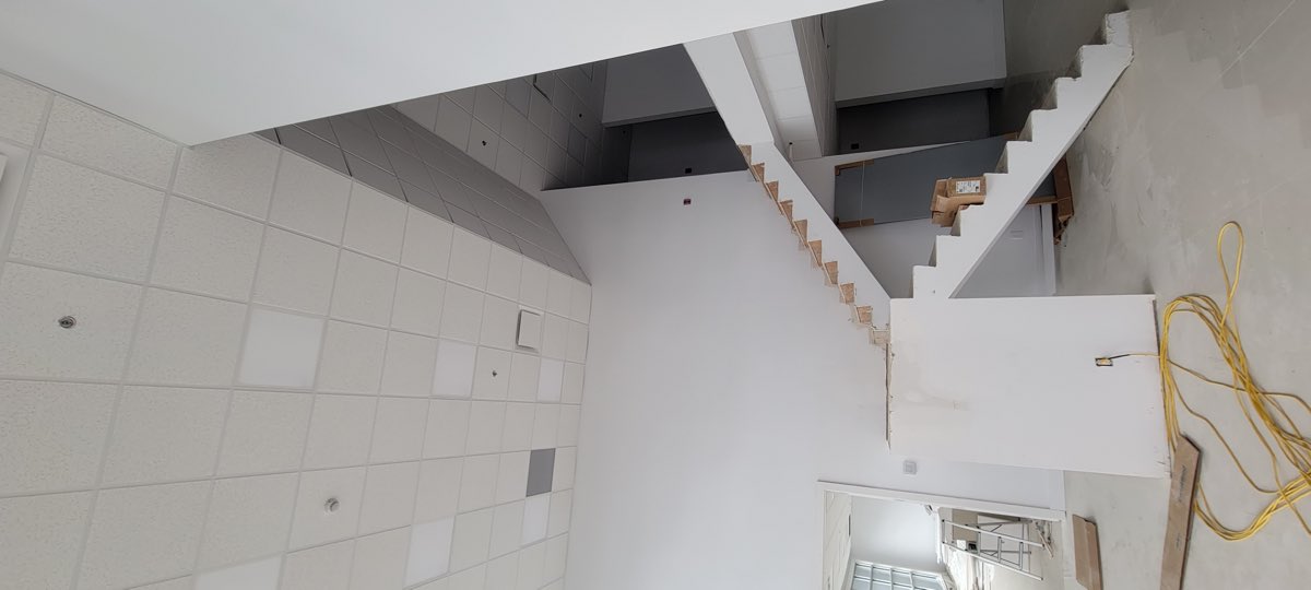 Suspended ceiling installation above a stair opening